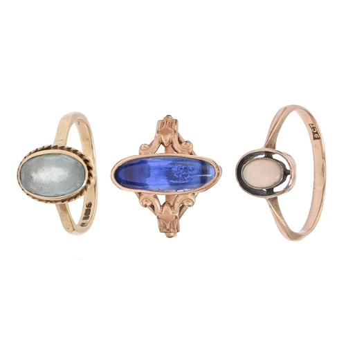 44 - An opal ring, in 9ct gold, marked 9ct, another gem set gold ring and a base metal ring with blue cab... 