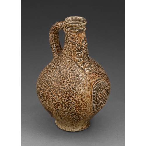 445 - A German saltglazed brown stoneware Bartmann bottle, 17th c, 22cm h