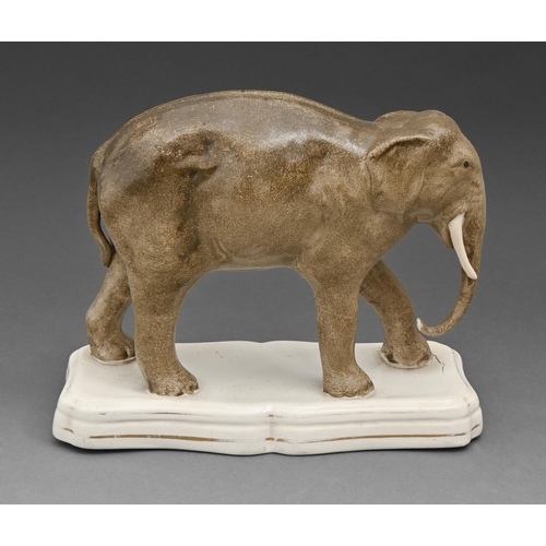 458 - A Staffordshire earthenware model of an elephant, mid 19th c, on shaped base with gilt line, 20cm h... 