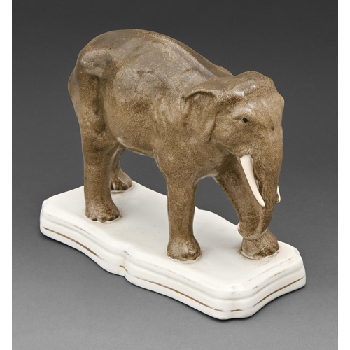 458 - A Staffordshire earthenware model of an elephant, mid 19th c, on shaped base with gilt line, 20cm h... 