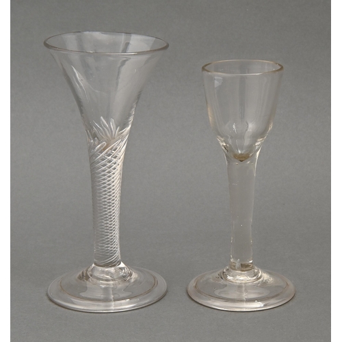 471 - A wine glass, mid 18th c,  the drawn trumpet bowl on multiple spiral air twist stem and folded foot,... 