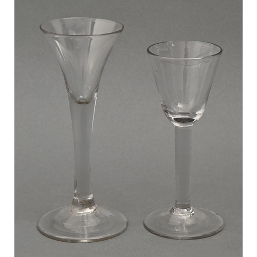 474 - Two wine glasses, mid 18th c,  the first with round funnel bowl on plain solid stem, the other with ... 