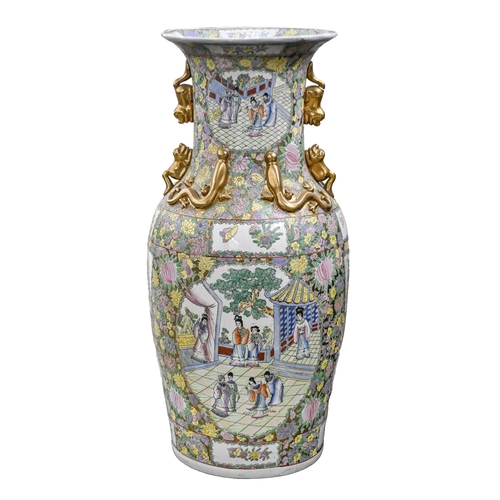 500 - A Chinese or South East Asian Canton famille rose style floor vase, late 20th c, applied with gilt d... 