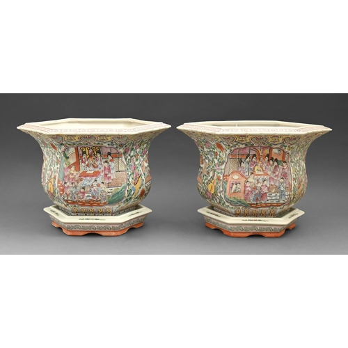 501 - A pair of Chinese reproduction hexagonal famille rose jardinieres and stands, late 20th c, 30cm h... 