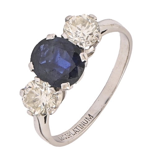 54 - A sapphire and diamond ring, the slightly larger sapphire flanked by evenly sized modified brilliant... 