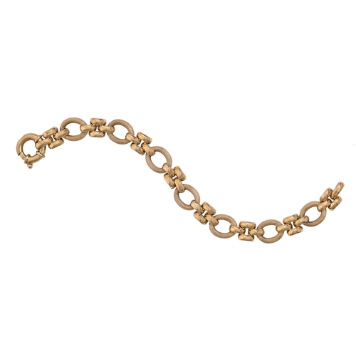 61 - A 9ct gold bracelet, of alternate quadruple and reeded oval links, 20cm l, import marked, date lette... 