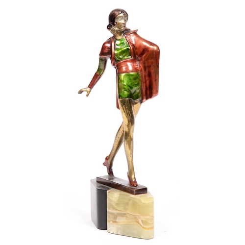 763 - An art deco painted spelter statuette of a lady on onyx and slate base, 27cm h