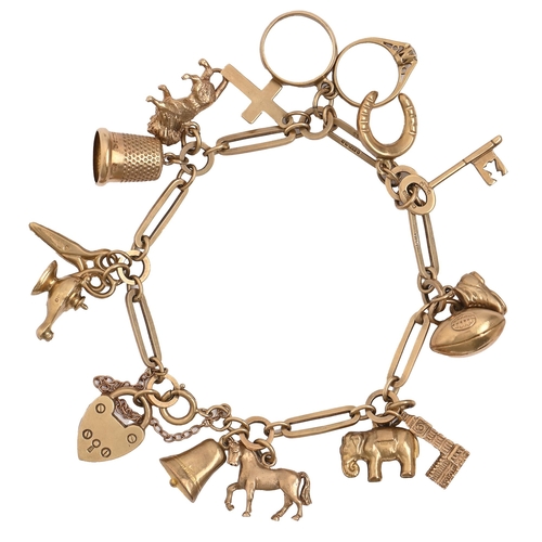 77 - A 9ct gold charm bracelet, with a collection of gold charms, 18cm l, 22g
