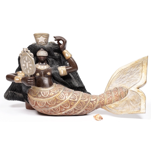 779 - A carved and painted wood sculpture of a mermaid, Brazil, second half 20th C, 75cm long... 