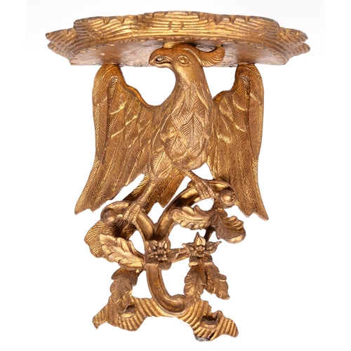 785 - A carved and pierced giltwood and composition bracket, in the form of an eagle, 37cm h... 