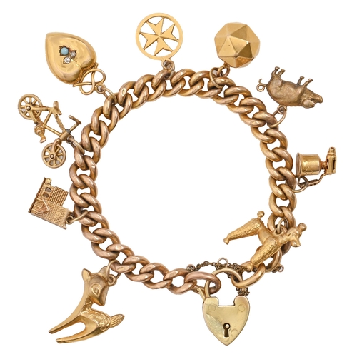 81 - A gold charm bracelet, hung with a collection of gold charms, including a Victorian diamond and turq... 