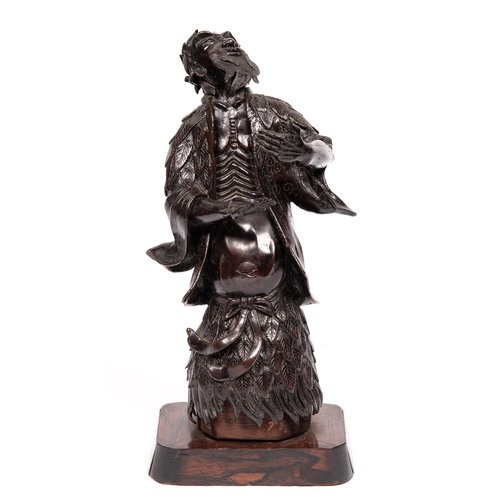 815 - A Chinese bronze okimono of a mythical figure, early 20th c, 30cm h, wood stand