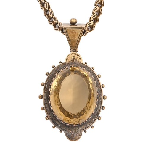 82 - A Victorian citrine pendant, in gold, 53mm h, on gold necklet
