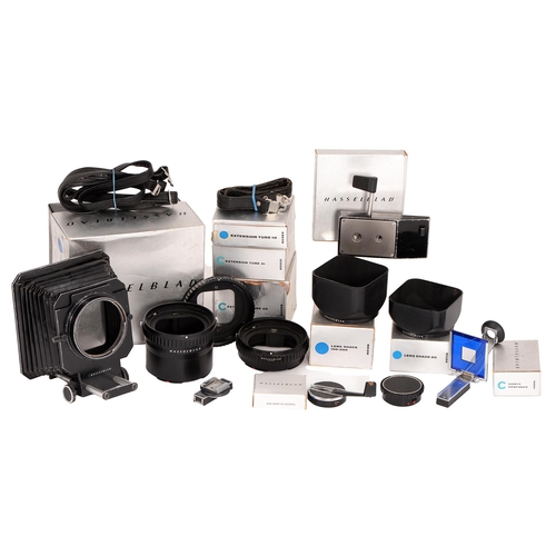 829 - A group of Hasselblad camera accessories, comprising bellows, lens hoods 80 and 100-250, extension t... 