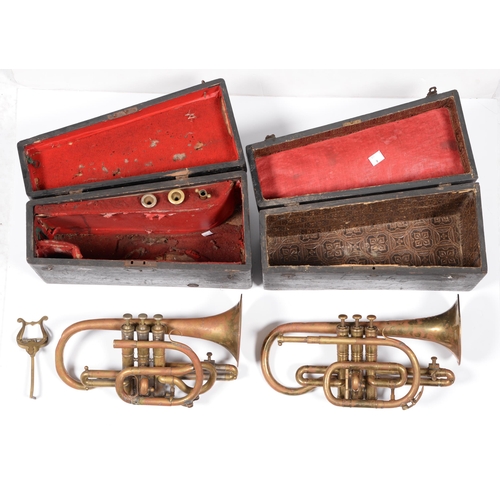 837 - Musical intrument. A cornet, early 20th c, in original fitted painted wood case, 36cm w, and another... 