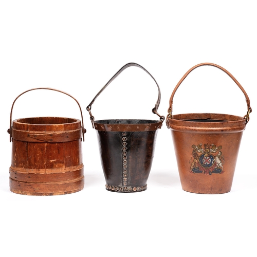 865 - A 19th c style leather cordite bucket, painted with a coat of arms, 26cm h, a copper-mounted leather... 