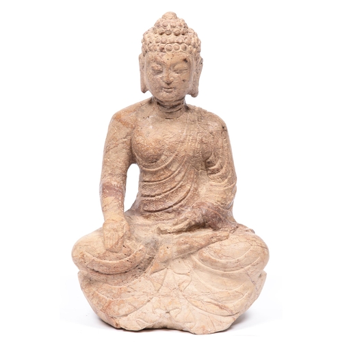 872 - A South East Asian carved stone statue of a Buddha, 40cm h