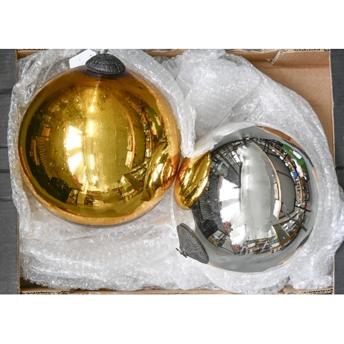 896 - A gold coloured witches ball, approx 25cm w, made in India of recent manufacture and another in silv... 