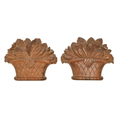 921 - A pair of carved oak basket of fruit appliques, c.1900, 22cm h