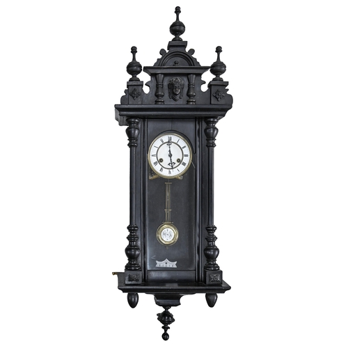 939 - An ebonised Vienna wall clock, c.1900, with white enamel dial and pendulum bob, 95cm h... 