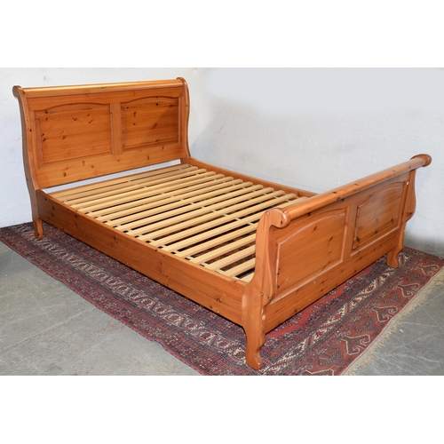 1321 - A pine sleigh bed, to fit mattress 195 x 140cm