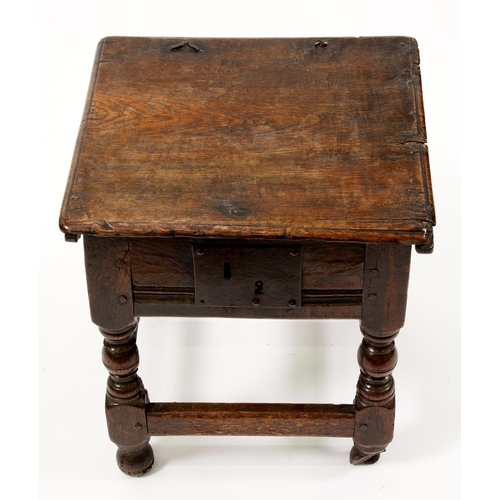 1158 - A Charles II joined oak box stool, with channelled rails and iron lock plate, on turned legs with st... 