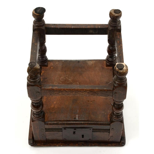 1158 - A Charles II joined oak box stool, with channelled rails and iron lock plate, on turned legs with st... 