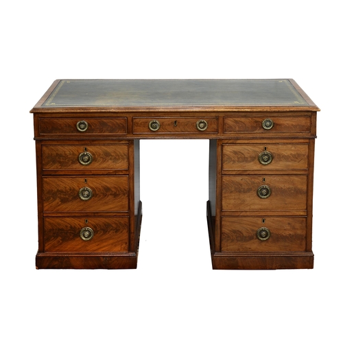 1187 - A mahogany pedestal desk, early 20th c, fitted with nine figured drawers with brass ring pulls and o... 