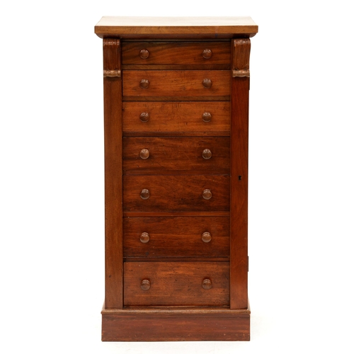 1200 - A Victorian mahogany wellington, chest of seven drawers flanked by standards, one locking, 106cm h; ... 