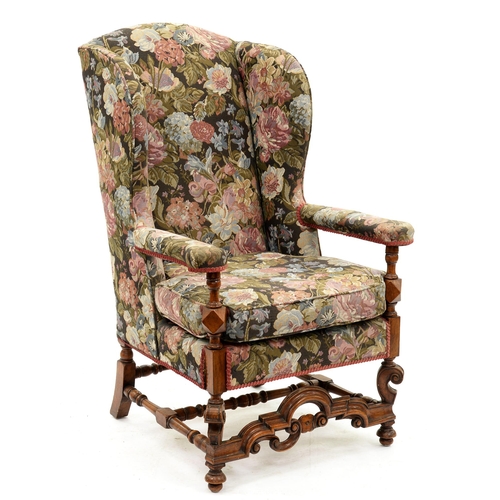 1202 - A Flemish style wing back armchair, early 20th c, 123cm h