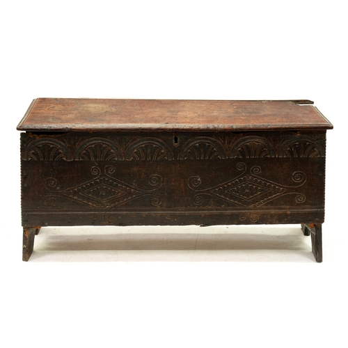 1207 - An English boarded oak chest, late 17th/early 18th c, the front with carved lunette frieze and two l... 