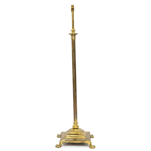 1217 - An Edwardian brass columnar telescopic oil lamp stand, on four feet, adapted for electricity, 133cm ... 