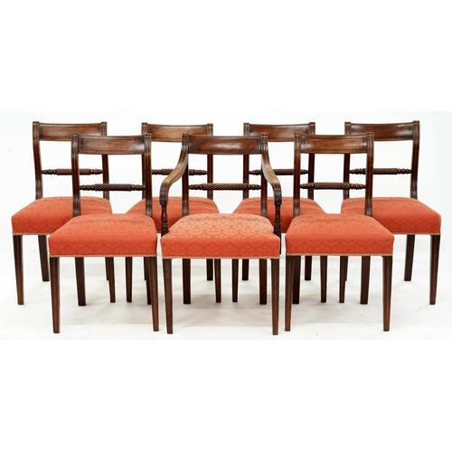 1237 - A set of seven George IV mahogany dining chairs, c. 1820, including one elbow chair, tapering reeded... 