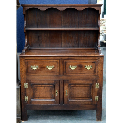 1243 - An oak dresser and rack, in 18th c style, 149cm h; 106 x 51cm