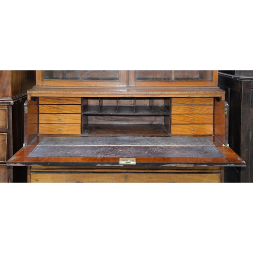 1249 - A George IV mahogany secretaire bookcase, c. 1820, the doors with glazed bars and inlaid in marquetr... 