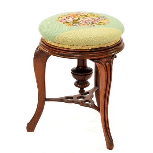 1254 - A Victorian walnut piano stool with padded floral woolwork top, 45cm h