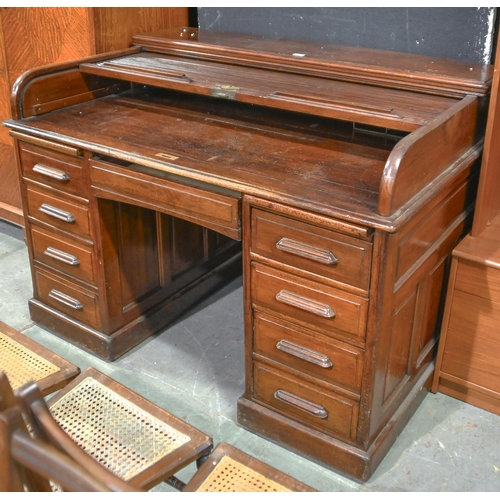 1311 - A mahogany pedestal desk, early 20th c, with tambour shutter, 98cm h; 137cm x 90cm