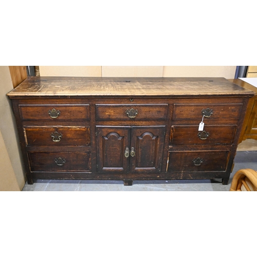 1314 - An early 19th c oak Lancashire chest, the lower part with cupboard and closed by panelled doors, fou... 