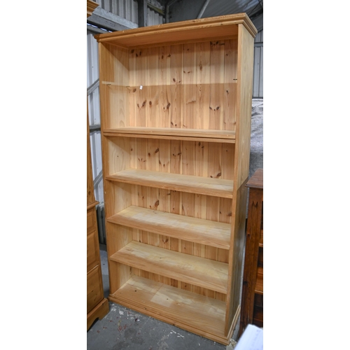 1325 - A pine open bookcase, 183cm h x 92cm and a mahogany stained pine open bookcase, 102cm h... 