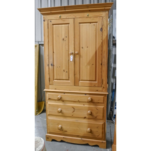 1326 - A modern pine linen press, the upper part fitted with a rail and enclosed with panelled doors, 196cm... 