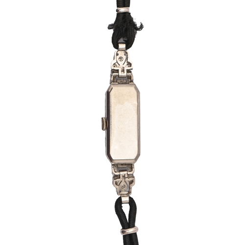 139 - A diamond cocktail watch, c1940, in platinum with articulated lugs, 11mm x 52mm