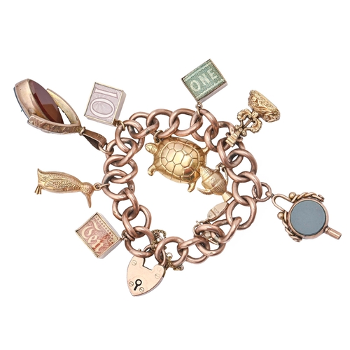 144 - A gold charm bracelet with a collection of gold charms and 9ct padlock 18cm long 48.2g... 