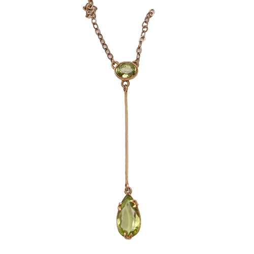 176 - A peridot pendant in gold, 48mm high, on integral gold necklet, 2.8g