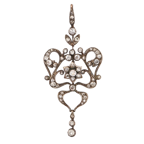 207 - A fin de siecle diamond pendant, of scrolling openwork design, with diamond drop, in silver and gold... 