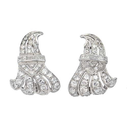 208 - A pair of diamond earrings, mid 20th c, in white gold coloured metal, 23mm h, 7.2g