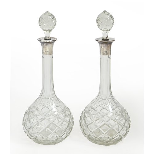 353 - A pair of George V silver mounted cut glass decanters and stoppers, 38cm h, by James Deakin & So... 