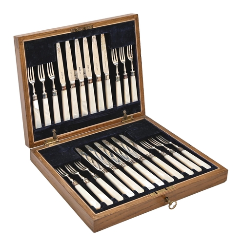 388 - A set of twelve George V mother-of-pearl hafted silver dessert knives and forks, by Mappin & Web... 