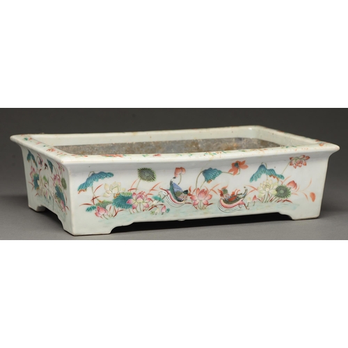 392 - A Chinese famille rose rectangular jardiniere, 19th c, painted with wading and other birds, lotus an... 