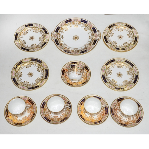 434 - An English porcelain tea service, c.1900, with gilt scrolls and rim, the border with cobalt blue gro... 