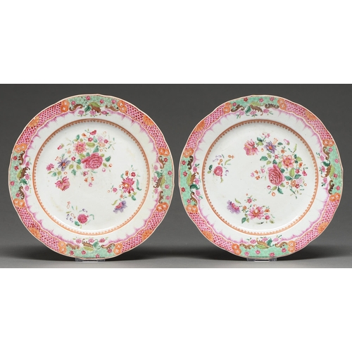 439 - A pair of Chinese export famille rose plates, c.1770, enamelled with peonies, the border with altern... 